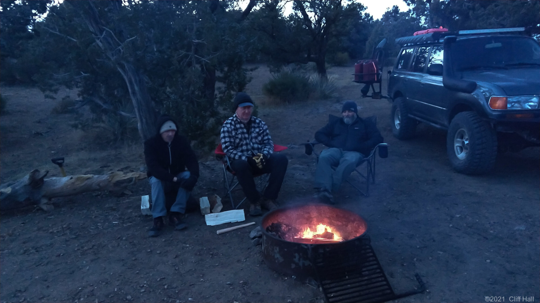Duc, Don and Ben warm up by the fire